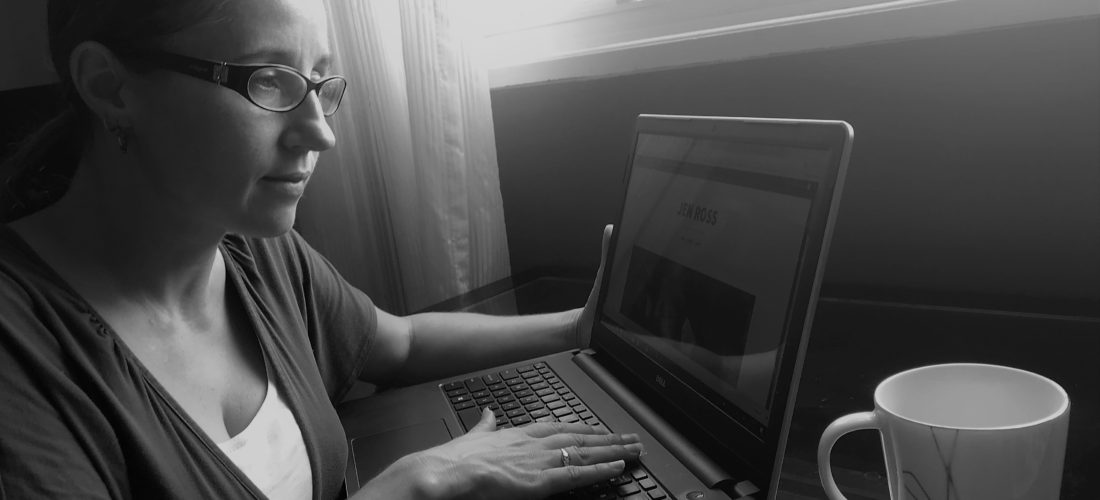 Jen at computer (black and white)