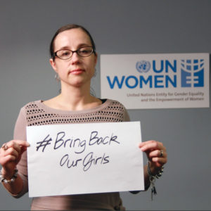 Jen holding a #BringBackOurGirls campaign sign, to urge the release of the 200+girls kidnapped by Boko Haram in Nigeria in 2014.