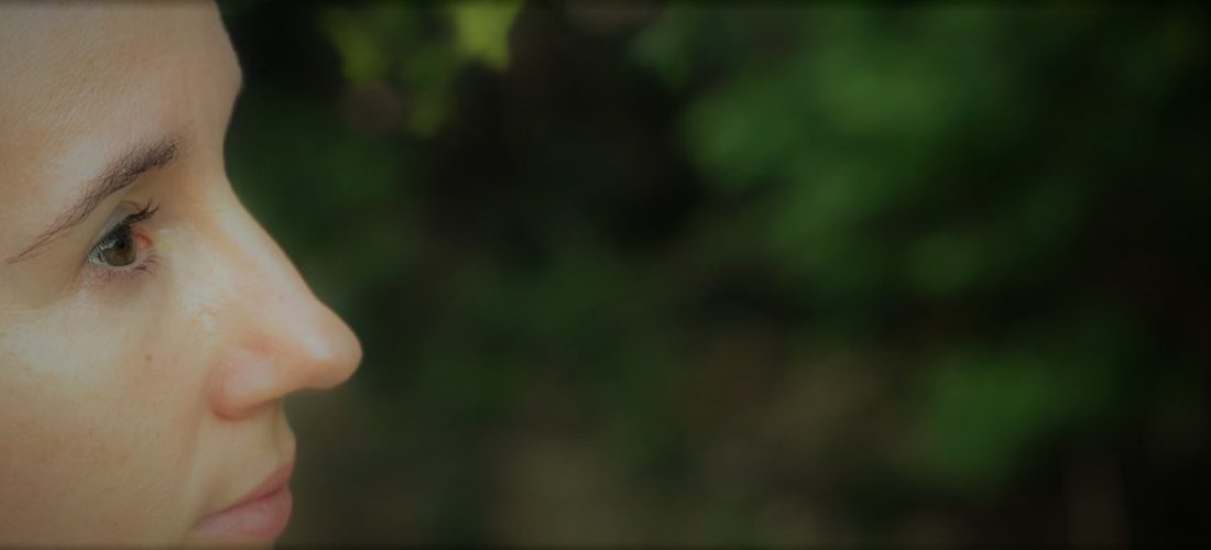Jen's profile with plants in the background